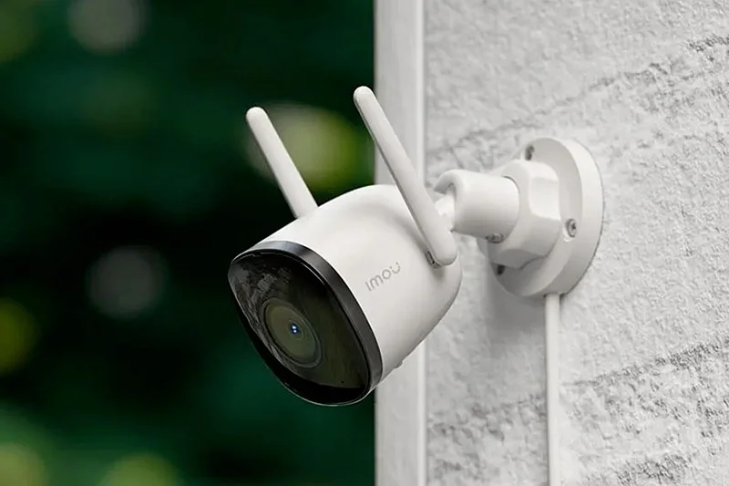 A close-up view of a modern motion detection home camera lens